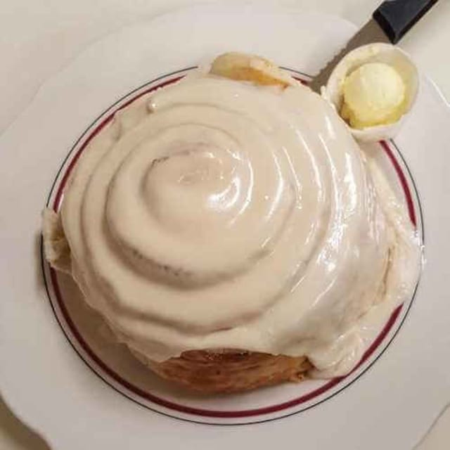 Cinnamon Roll with Walnuts and Raisins.